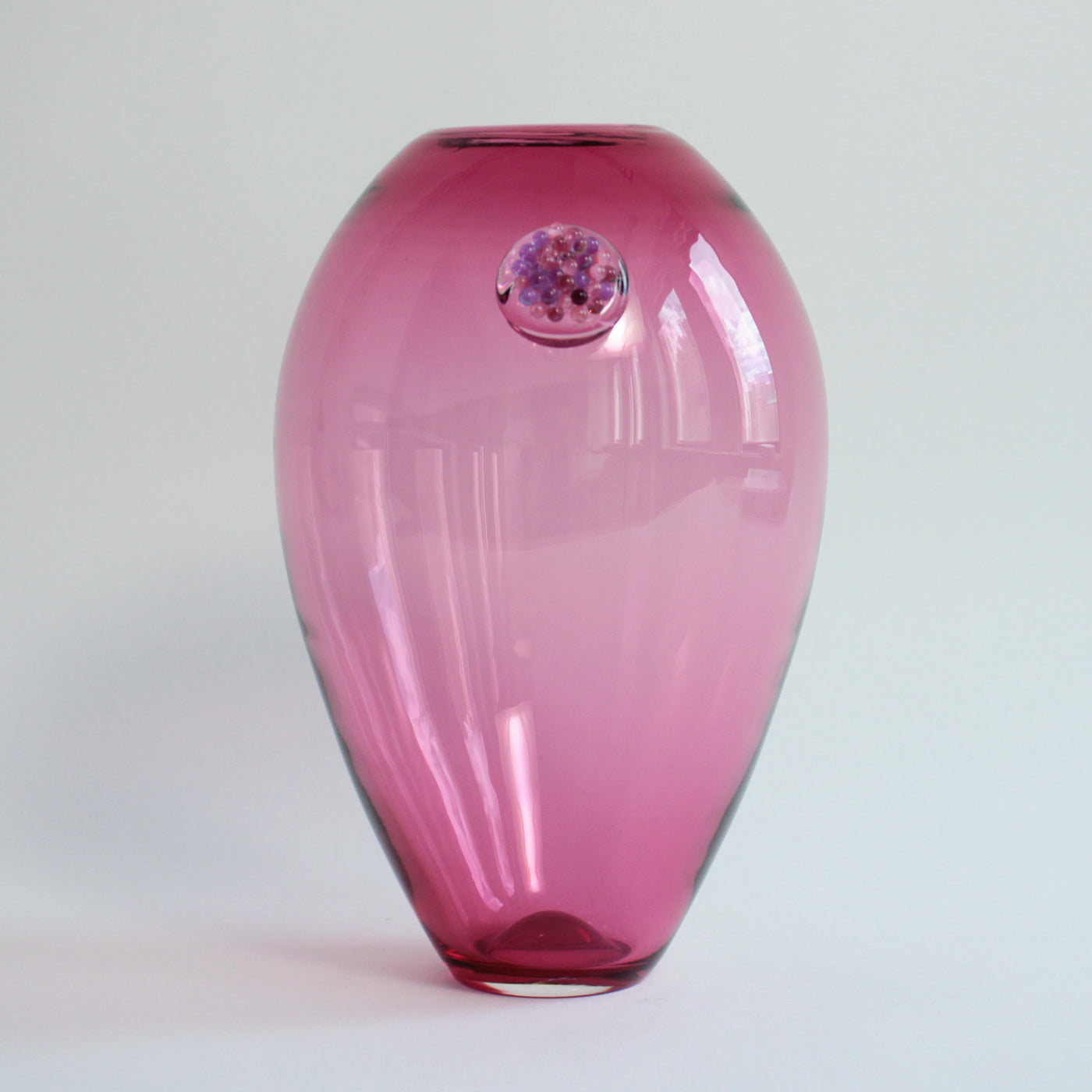 Vase grenade rose avec pépins violet